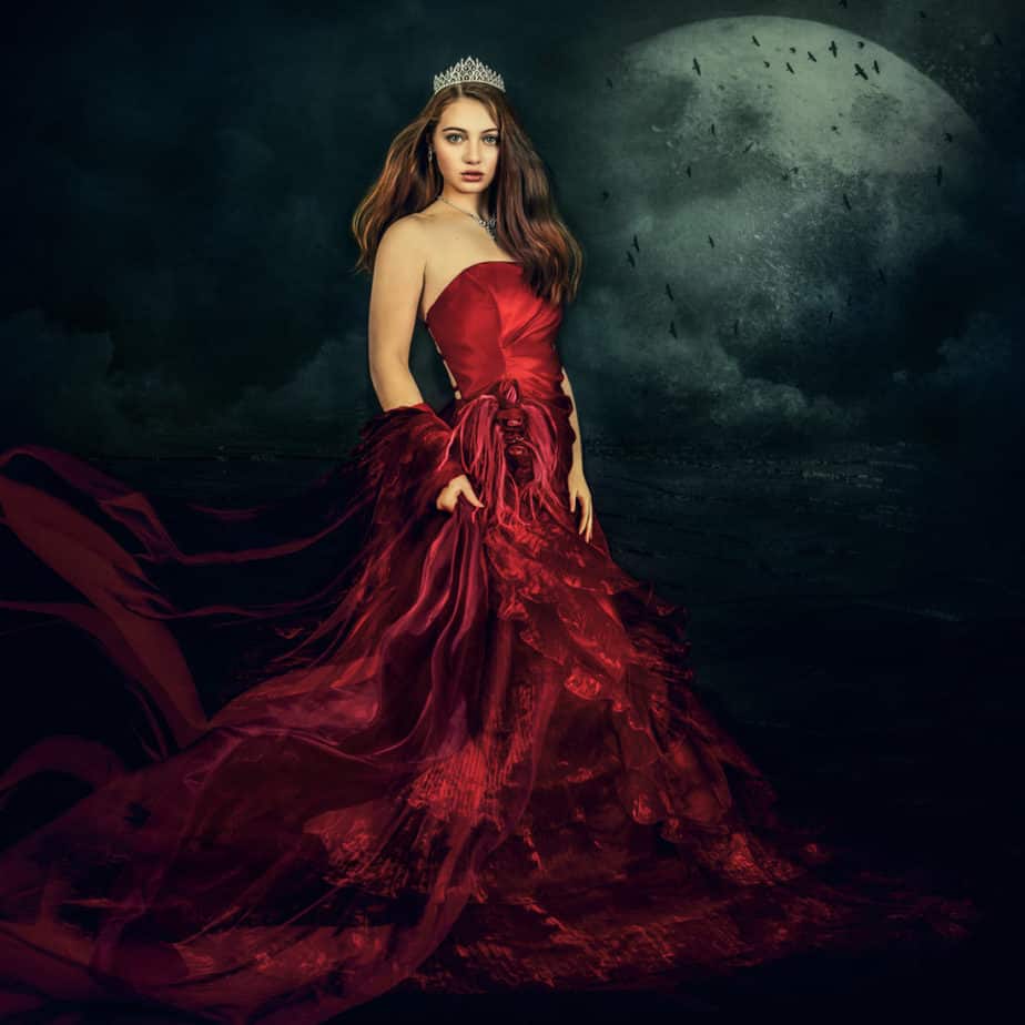 Conceptual photography, femaile in a red dress under the moon.